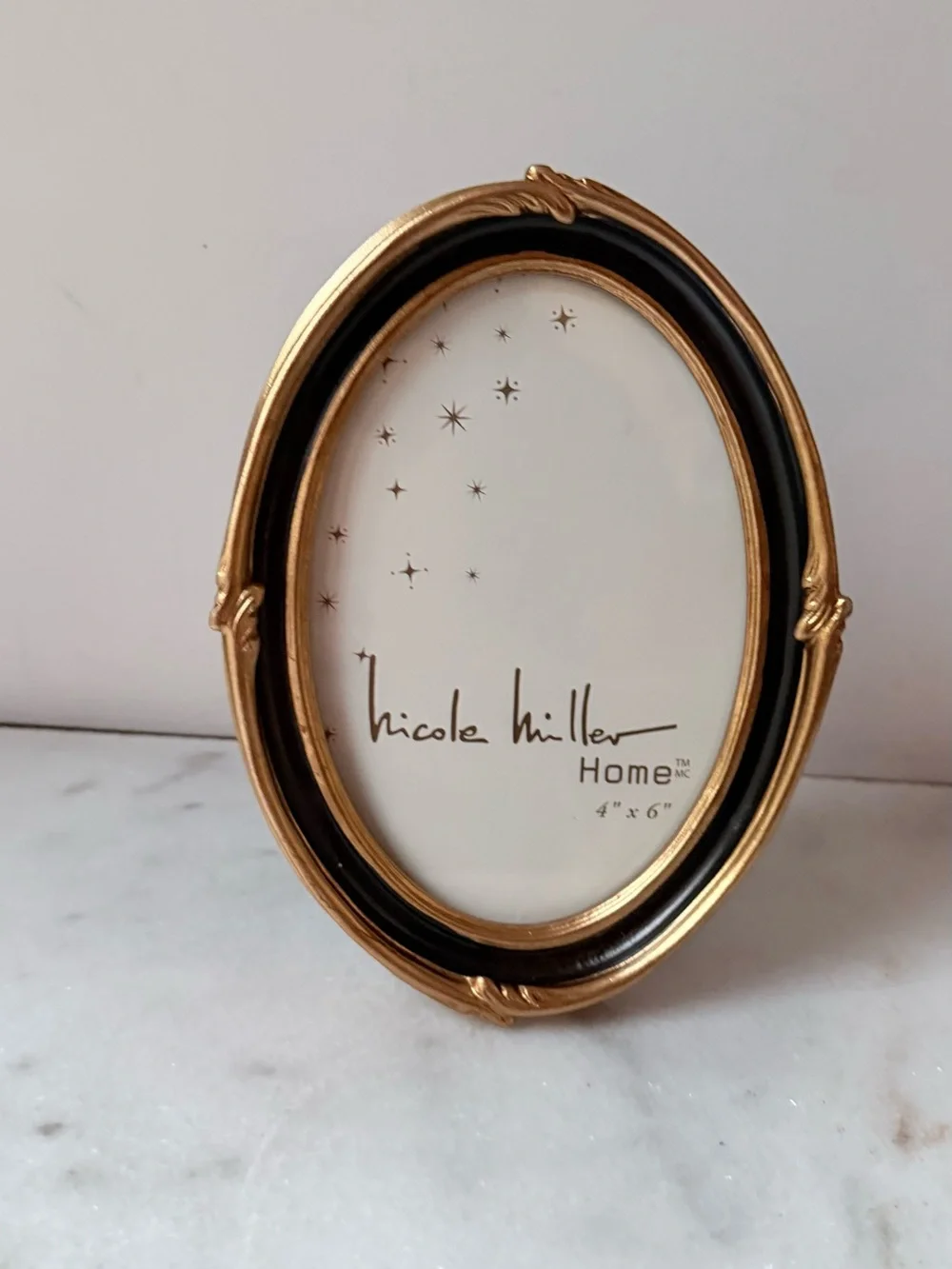 Nicole Miller stylish oval